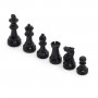 Chess pieces in white and black lacquered wood